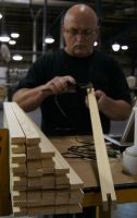 brightwood employee inspecting lumber