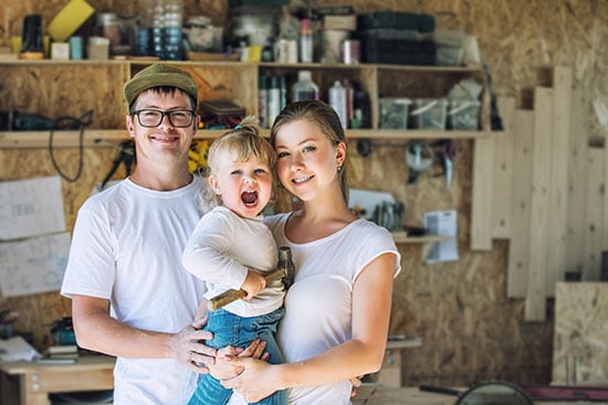 Woodworking family in workshop
